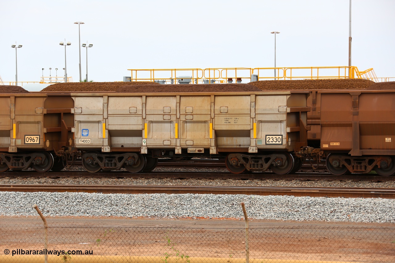 150523 8246
Nelson Point Yard, loaded ore waggon 2330, a CNR built QRRS style waggon built in 2014 out of T4003 stainless steel which does away with the need to paint the waggon interiors to prevent wear. The white circle around the corner from the number indicates the rotary coupler end, the number for this waggon also indicates it is a replacement for an original Comeng built waggon. Capacity 138.4 T, Tare 21.6 T and Volume 62 m3.
Keywords: CNR-QRRS-China;BHP-ore-waggon;