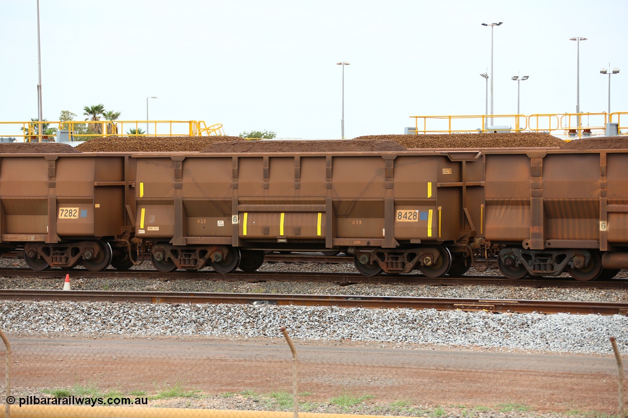150523 8248
Nelson Point Yard, loaded ore waggon 8428, a Golynx style waggon built by Goninan in 05-2005 serial no. 950141-008 and asset number of 2002738 out of 5Cr12Ti stainless steel which does away with the need to paint the waggon interiors to prevent wear. This waggon was originally a bottom discharge hopper for use on the Goldsworthy Line prior to the unloader at Finucane Island being replaced with a rotary cell dumper.
Keywords: Goninan-WA;Golynx;BHP-ore-waggon;