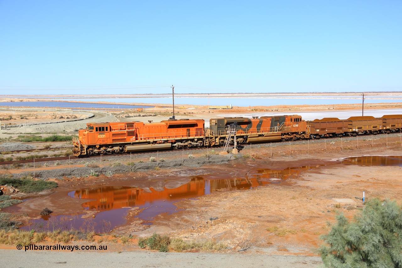 170726 9429
Redbank, a loaded BHP iron ore train from Yandi arrives past the arrival signals for Nelson Point yard on the west mainline behind Electro Motive built SD70ACe unit 4331 'Withnell' serial 20066862-060 leading an SD70ACe/LC with another two SD70ACe/LC units in the middle of the 264 waggon consist. 26th July 2017.
Keywords: 4331;Electro-Motive-London-Ontario;EMD;SD70ACe;20066862-060;