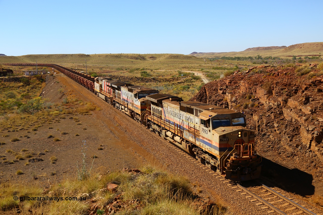 170728 09833
Western Creek - Emu area, an empty train from Dampier climbs the grade on approach to the Robe River line overpass behind original liveried General Electric built Dash 9-44CW units 7093 serial 47772 and 7081 with third unit a stablemate ES44DCi 8189, the blue lights on the cab of 7093 being illuminated as the train is operating in AutoHaul™ mode. 28th July 2017. [url=https://goo.gl/maps/vvUWXEgppNM2]GeoData[/url].
Keywords: 7093;GE;Dash-9-44CW;47772;