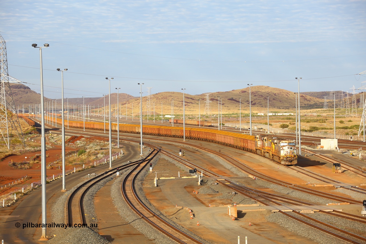 170729 0076
Cape Lambert South yard, a loaded train heads towards car dumper 5 behind General Electric built ES44DCi unit 8103 serial 57999 in original Rio Tinto silver with a Dash 9-44CW unit 7076 and sister ES44DCi unit 8129 in the later Rio Tinto stripe livery. 29th July 2017. [url=https://goo.gl/maps/zQ62JNaib6J2]GeoData[/url].
Keywords: 8103;GE;ES44DCi;57999;