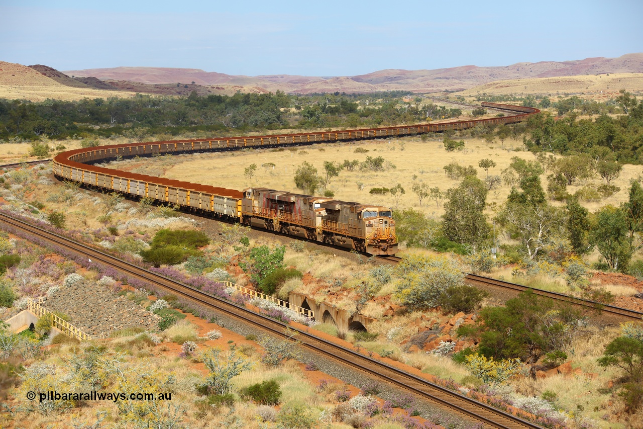 170729 0119
Green Pool, as they cross the #6 bridge on the original Robe River line with their train snaking all the way back to Western Creek, General Electric built ES44DCi unit 8114 serial 59106 in original silver livery and operating in AutoHaul™ with later sister units 8120 and 8148 with a loaded train from Yandicoogina. 29th July 2017. [url=https://goo.gl/maps/hJHqGCy1HKk]GeoData[/url].
Keywords: 8114;GE;ES44DCi;59106;