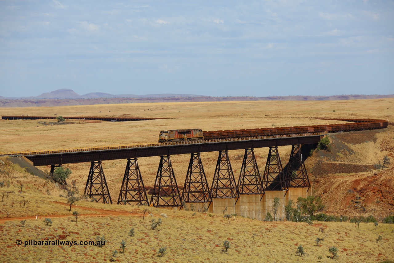 170729 0163
Fortescue River Bridge on the Robe River line at the 115.8 km, a loaded Deepdale train heading for Cape Lambert behind the standard motive power for this line, double General Electric built ES44ACi units, 9114 serial 62545 and sister unit 9101 serial 61939 run over the largest rail bridge in the Pilbara. 29th July 2017. [url=https://goo.gl/maps/urXsiFNXfiz]GeoData[/url].
Keywords: 9114;GE;ES44ACi;62545;