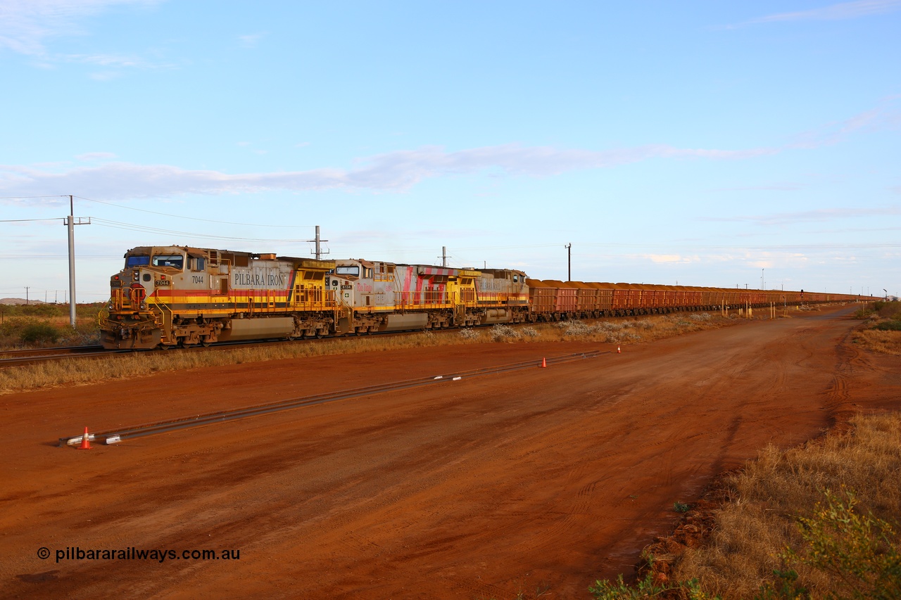 170729 0415
Seven Mile yard, a loaded train departs the yard for Parker Point dumpers behind General Electric built Dash 9-44CW unit 7044 serial 57095 in Pilbara Iron livery with HI reporting marks, ES44DCi unit 8134 in Rio Tinto stripes and another Dash 9-44CW unit 9407 in Pilbara Rail livery with Robe reporting marks. 29th July 2017. [url=https://goo.gl/maps/nSD3qYLHE462]GeoData[/url].
Keywords: 7044;GE;Dash-9-44CW;57095;