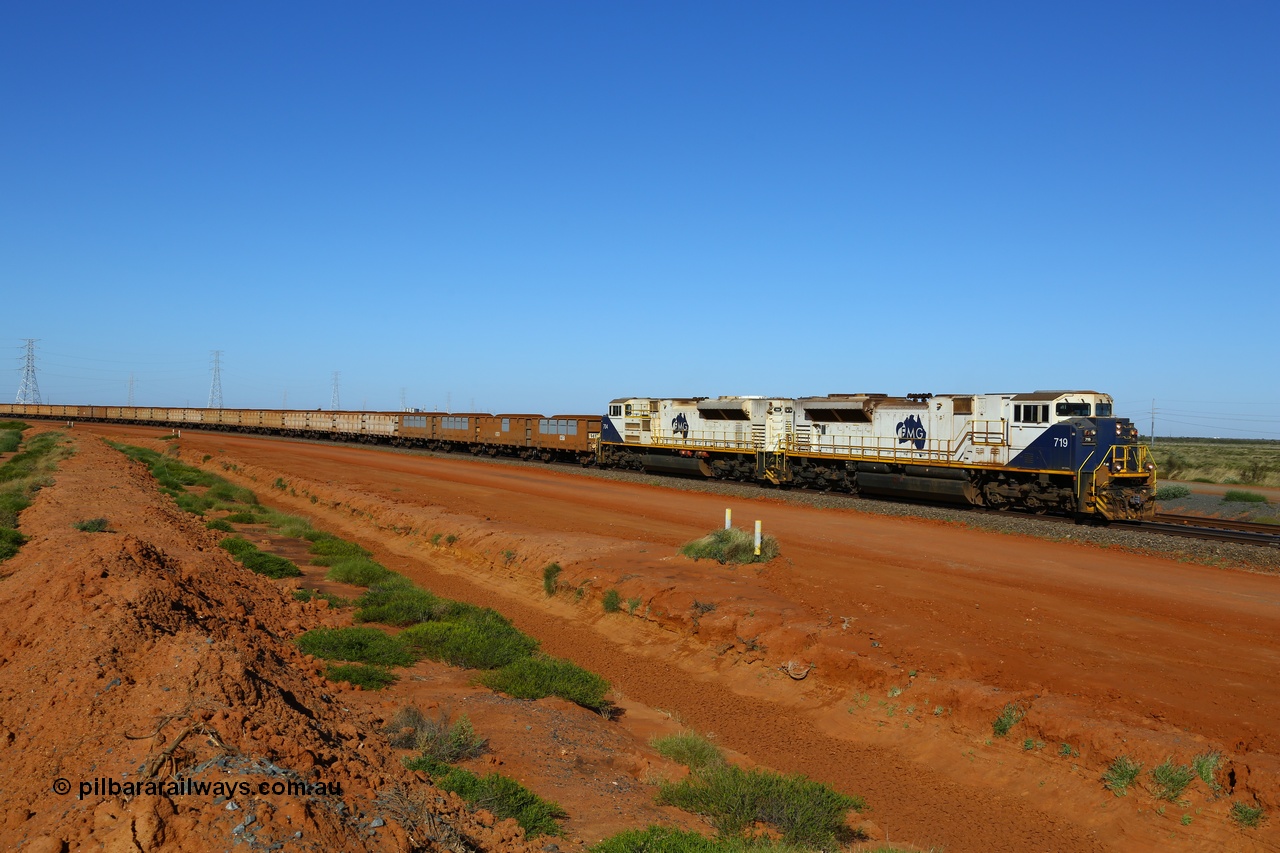 170730 0435
Boodarie, a loaded FMG iron ore train rounds the large curve at the 5 km as it approaches the car dumper balloon loops behind Progress Rail Muncie USA built SD70ACe/LCi unit 719 serial 20118693-011 and sister 704 with the first four waggons showing panel repairs and re-lining recently undertaken. 30th July 2017. [url=https://goo.gl/maps/phdYswaU3BR2]GeoData[/url].
Keywords: FMG-719;Progress-Rail-Muncie-USA;EMD;SD70ACe/LCi;20118693-011;