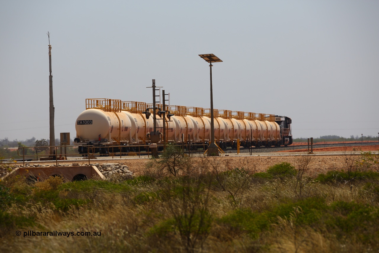 170915 0724
Great Northern Highway 18.2 km grade crossing, empty Roy Hill fuel train powers away north from the highway towards Tad Yard with General Electric built ES44ACi unit RHA 1019 leading eleven of Roy Hill's twelve tank waggons. 15th September 2017. [url=https://goo.gl/maps/DR61N4rDVZy]View map here[/url].
