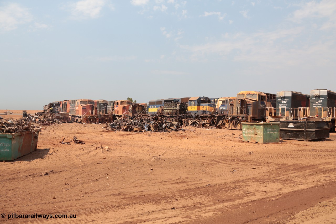 141027 5828
Wedgefield, Sell and Parker's metal recycling yard, overview of the carnage. Units visible awaiting the shears and gas are, GE AC6000 6073, EMD SD40R 3091, AC6000 6075, EMD SD40 3079, AC6000 6074 and 6072 and SD40R 3092 and 3089.
