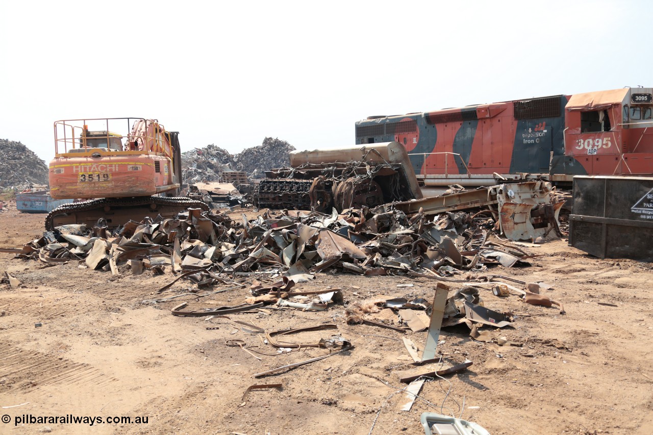 141027 5837
Wedgefield, Sell and Parker's metal recycling yard, view of EMD SD40R unit 3095 serial 33677/7083-7 watching a former sister unit being reduced to bits, a primer mover 645 EMD engine and fuel tank tipped on its side, and the excavator with the hydraulic shears.
Keywords: 3095;EMD;SD40R;33677/7083-7;SD40;SP8485;