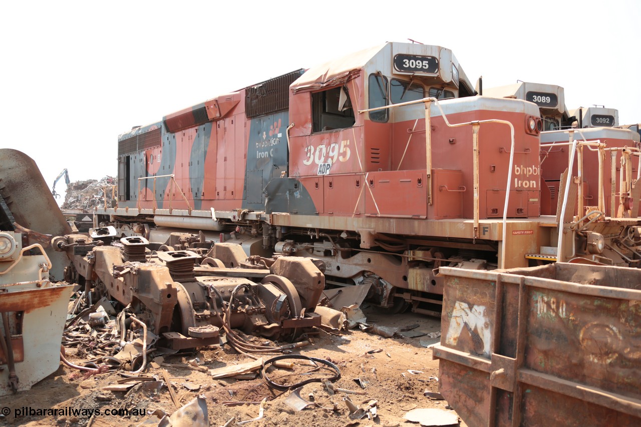 141027 5852
Wedgefield, Sell and Parker's metal recycling yard, view of EMD SD40R unit 3095 serial 33677/7083-7 watching a former sister unit being reduced to bits, a primer mover 645 EMD engine and fuel tank tipped on its side, pilot and bogie, and the excavator with the hydraulic shears.
Keywords: 3095;EMD;SD40R;33677/7083-7;SD40;SP8485;