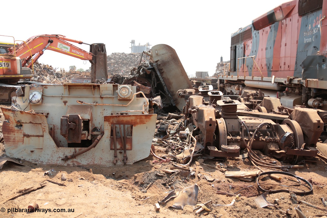 141027 5853
Wedgefield, Sell and Parker's metal recycling yard, view of and EMD SD40R unit primer mover 645 EMD engine and fuel tank tipped on its side, pilot and bogie.
