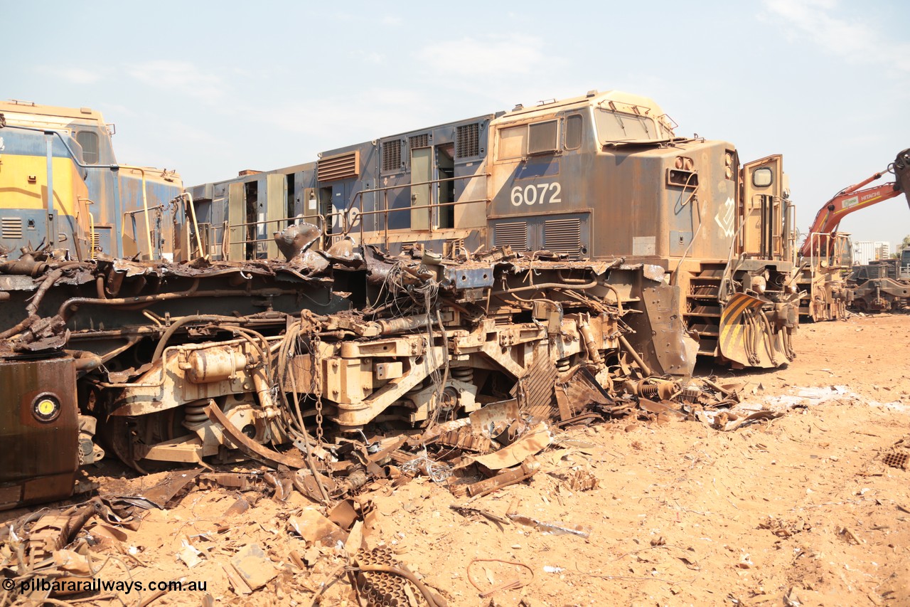 141027 5889
Wedgefield, Sell and Parker's metal recycling yard, view of the trailing bogie and frame of GE AC6000 unit 6071 as sister unit 6972 awaits the same treatment.
Keywords: 6071;GE;AC6000;51063;