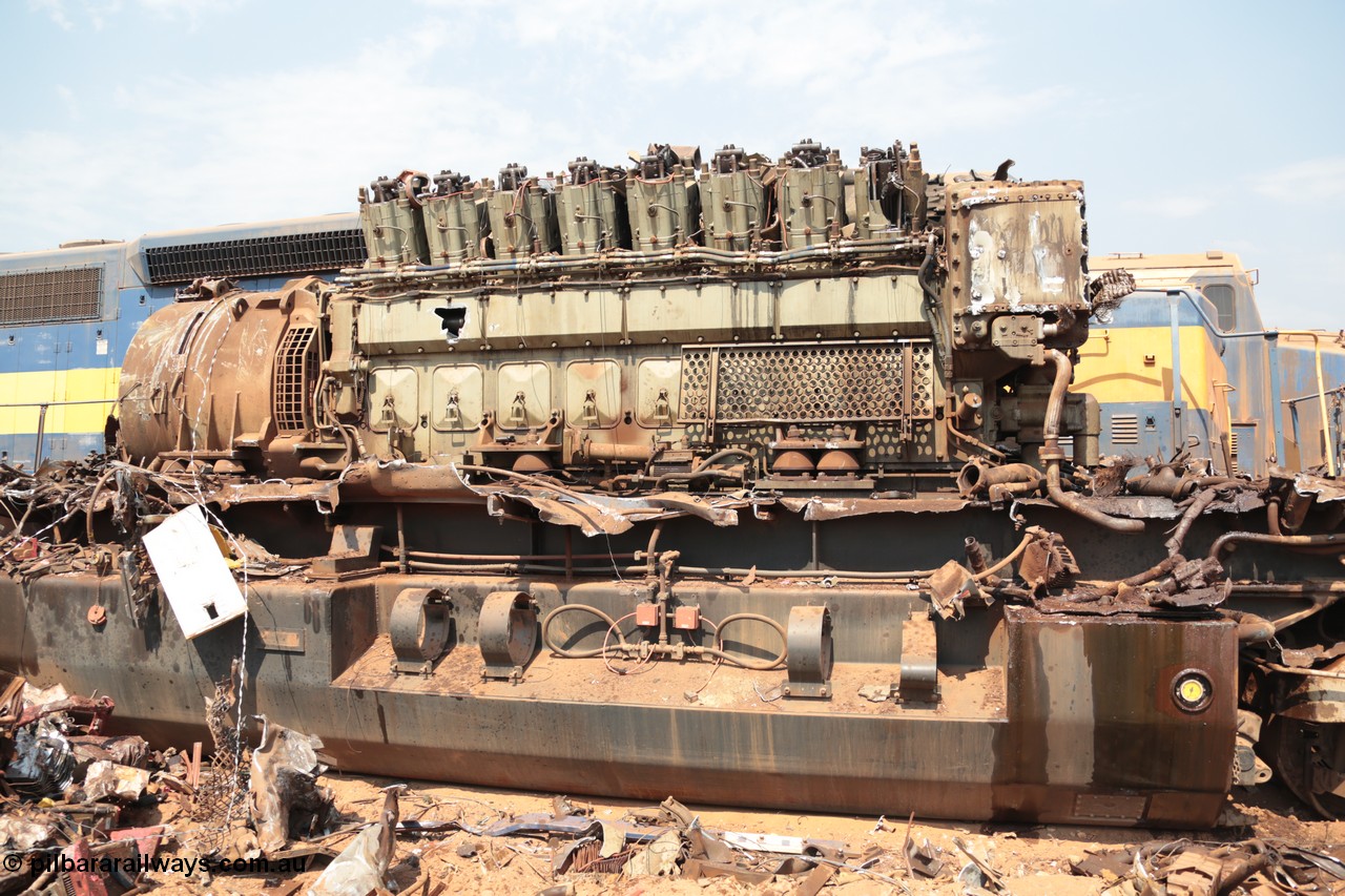 141027 5891
Wedgefield, Sell and Parker's metal recycling yard, General Electric AC6000 unit 6071 serial 51063 6600 hp GEVO-16 motor and GE 5GMG201 alternator awaiting the thermal lance.
Keywords: 6071;GE;AC6000;51063;