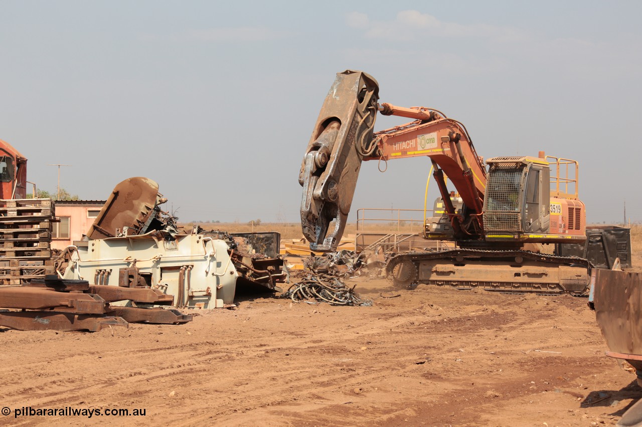 141027 5913
Wedgefield, Sell and Parker's metal recycling yard, view of Hitachi ZAXIS 350 LCH excavator fitted with the huge hydraulically operated shears that are making a meal of former EMD SD40 and GE AC6000 locomotives. Besides it lays the remains of an EMD SD40R unit which has been reduced to a few frame part with the EMD 645 engine laying over.
