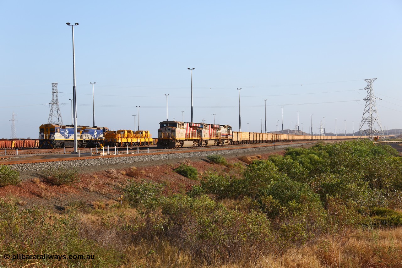 151111 9483
Cape Lambert Yard, empty train with motive power of General Electric ES44DCi units 8160 and 8193 serials 60224 and 61852 and General Electric Dash 9-44CW 7074 serial 47743 waiting to depart with leased CFCLA CD class shunt units CD 4302 and CD 4305 and compressor car sets CB 13 and CB 16.
Keywords: 8160;GE;ES44DCi;60224;
