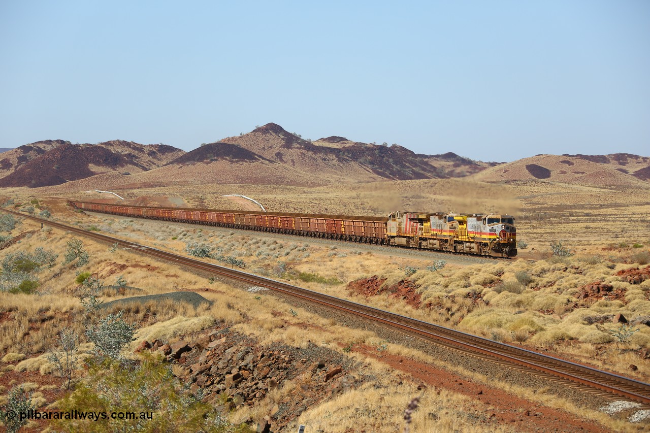 151111 9501
At the 47 km post on the Cape Lambert line a loaded train runs along on the West Mainline behind 7050 and 7057 both General Electric Dash 9-44CW units with serials of 57101 and 55882 and the last General Electric ES44DCi 8199, serial 61858.
Keywords: 7050;GE;Dash-9-44CW;57101;