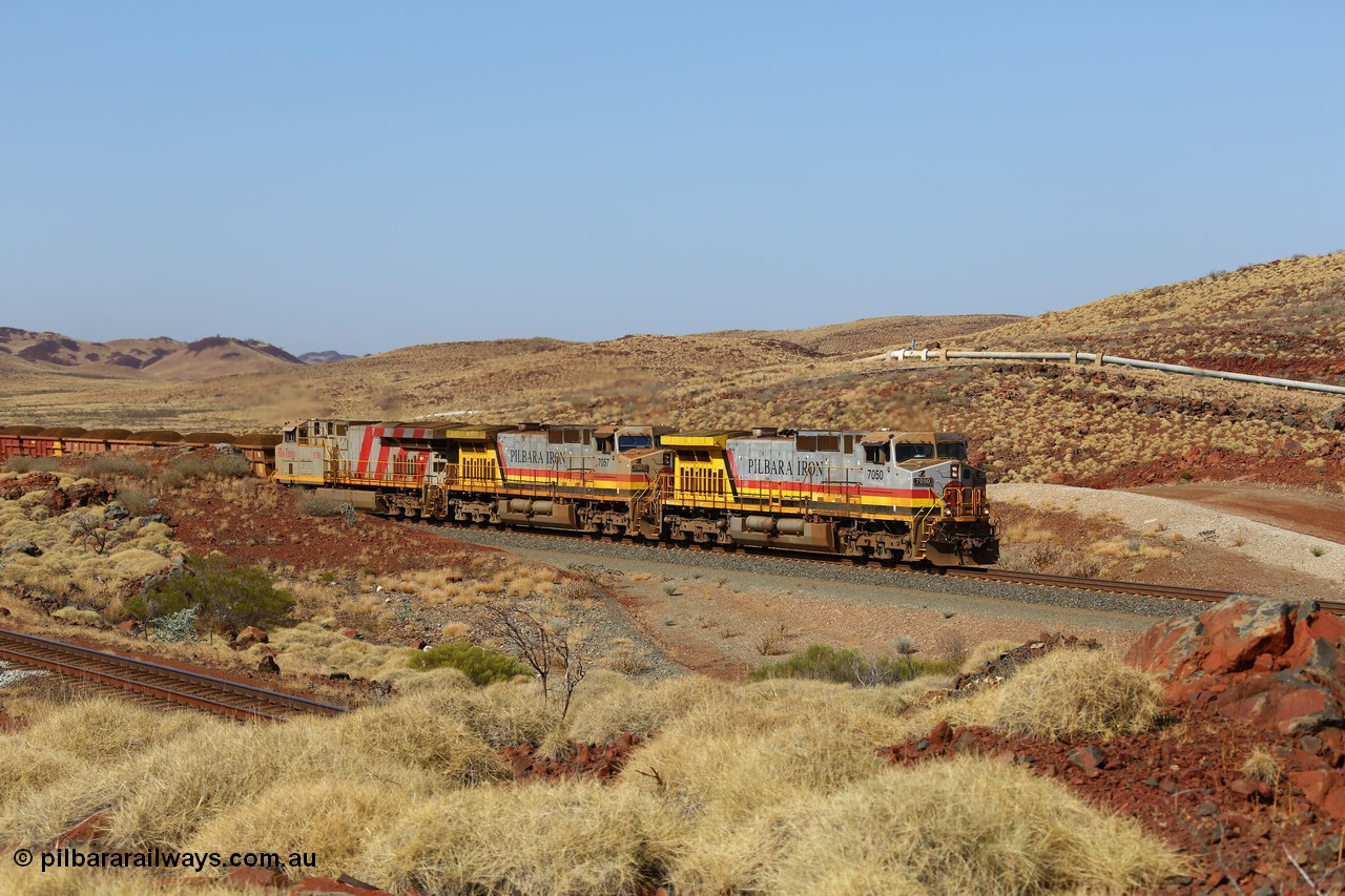 151111 9502
At the 47 km post on the Cape Lambert line a loaded train runs along on the West Mainline behind 7050 and 7057 both General Electric Dash 9-44CW units with serials of 57101 and 55882 and the last General Electric ES44DCi 8199, serial 61858.
Keywords: 7050;GE;Dash-9-44CW;57101;