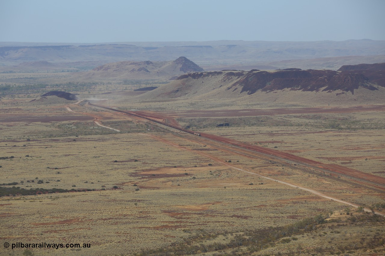 151111 9504
A loaded train behind General Electric ES44DCi units 8113 serial 59105 in the original silver livery and 8145 serial 58726 in the tiger strip Rio livery and Dash 9-44CW 9433 serial 54766 in ROBE Pilbara Iron livery runs along on the West Mainline bound for Cape Lambert viewed from Table Hill.

