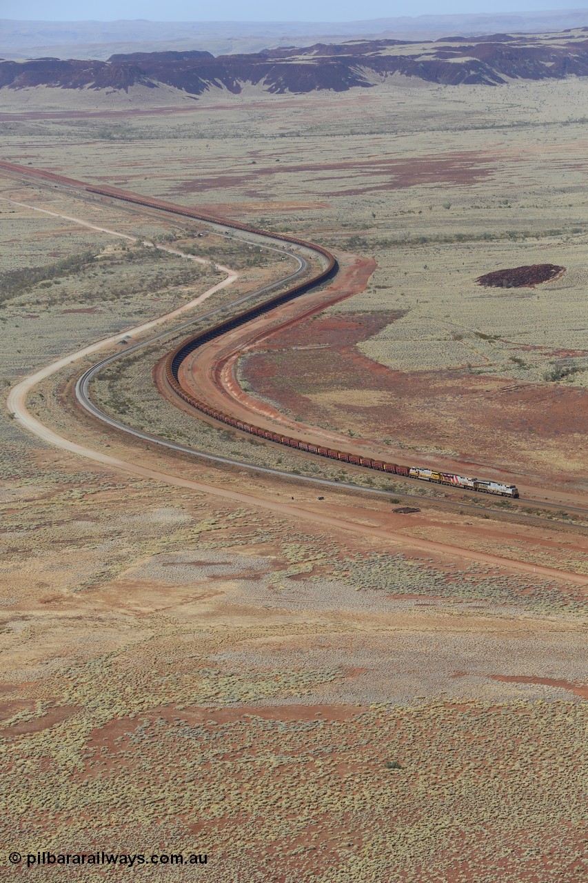 151111 9514
A loaded train behind General Electric ES44DCi units 8113 serial 59105 in the original silver livery and 8145 serial 58726 in the tiger strip Rio livery and Dash 9-44CW 9433 serial 54766 in ROBE Pilbara Iron livery runs along on the West Mainline bound for Cape Lambert viewed from Table Hill.
Keywords: 8113;GE;ES44DCi;59105;