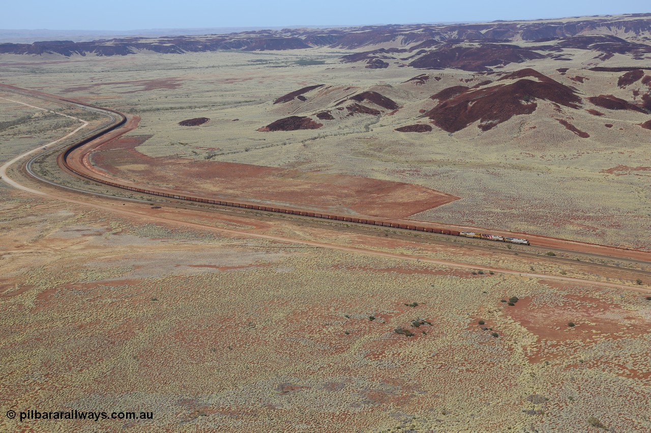 151111 9519
A loaded train behind General Electric ES44DCi units 8113 serial 59105 in the original silver livery and 8145 serial 58726 in the tiger strip Rio livery and Dash 9-44CW 9433 serial 54766 in ROBE Pilbara Iron livery runs along on the West Mainline bound for Cape Lambert viewed from Table Hill.
Keywords: 8113;GE;ES44DCi;59105;
