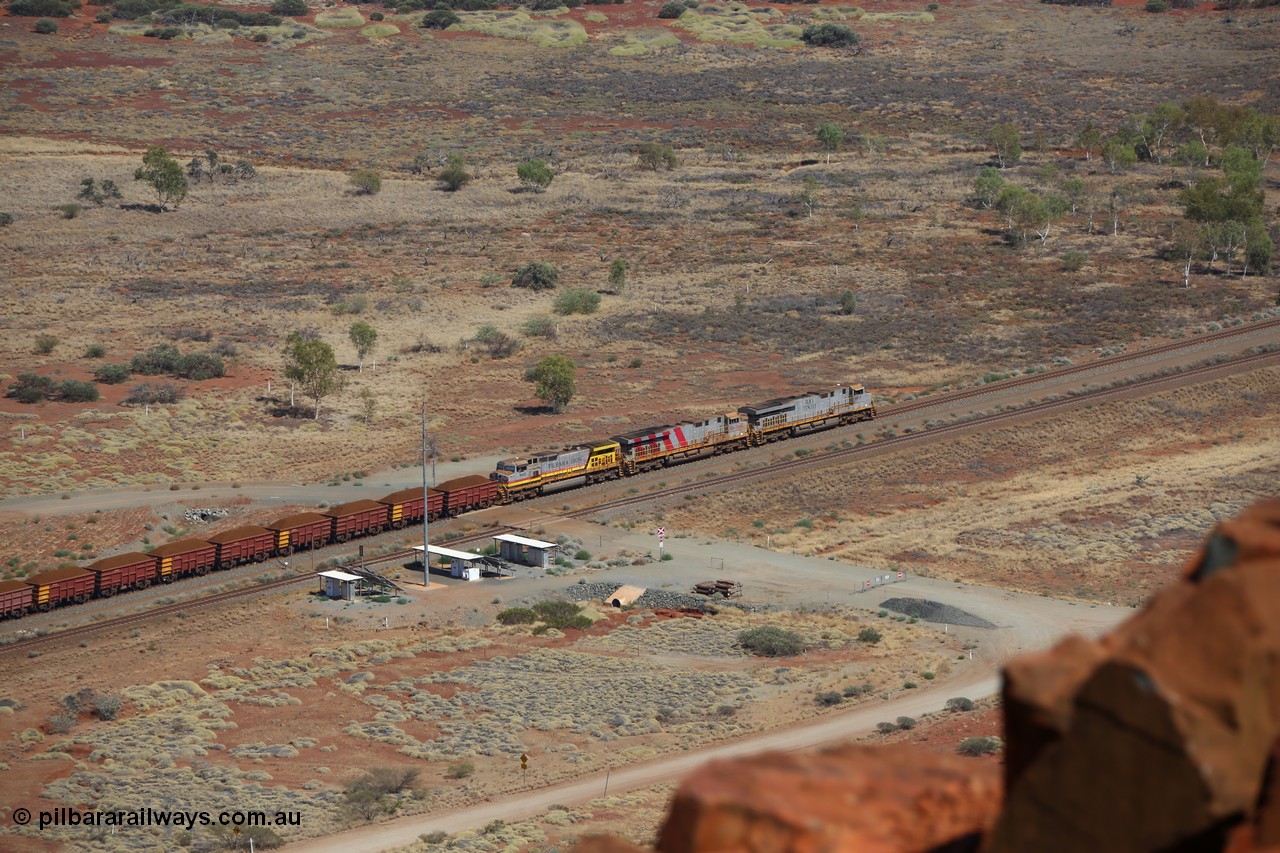 151111 9531
A loaded train behind General Electric ES44DCi units 8113 serial 59105 in the original silver livery and 8145 serial 58726 in the tiger strip Rio livery and Dash 9-44CW 9433 serial 54766 in ROBE Pilbara Iron livery runs along on the West Mainline bound for Cape Lambert viewed from Table Hill.
Keywords: 8113;GE;ES44DCi;59105;