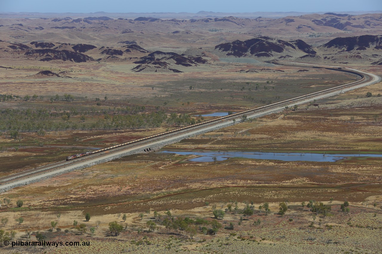 151111 9542
An empty train led by General Electric ES44DCi units 8162 serial 60226 and 8167 serial 60231 both in the Rio Tinto tiger strip livery leading Dash 9-44CW 7093 serial 47772, the last of the original build of Dash 9 units crossing Lake Poongkaliyarra.
Keywords: 8162;GE;ES44DCi;60226;
