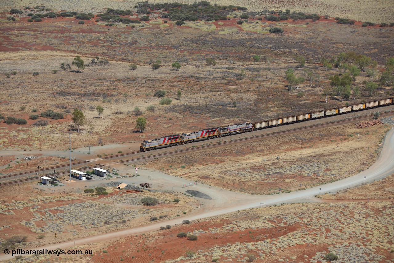 151111 9545
An empty train led by General Electric ES44DCi units 8162 serial 60226 and 8167 serial 60231 both in the Rio Tinto tiger strip livery leading Dash 9-44CW 7093 serial 47772, the last of the original build of Dash 9 units at the 52.9 km grade crossing.
Keywords: 8162;GE;ES44DCi;60226;