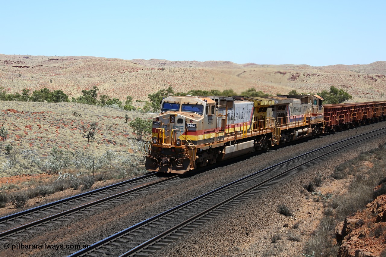 151111 9570
An empty train struggles upgrade at the 87.5 km post on the Tom Price line behind double General Electric Dash 9-44CW units 9403 serial 53457 wearing ROBE Pilbara Rail livery and 7087 serial 47766 wearing the original Hamersley Iron livery.
Keywords: 9403;GE;Dash-9-44CW;53457;