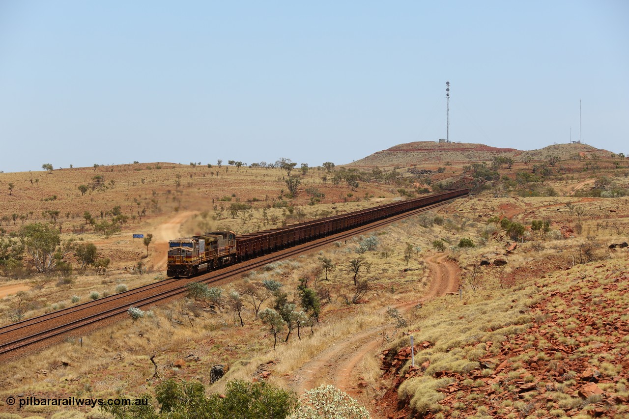 151111 9574
An empty train is still struggling upgrade at the 98 km post on the Tom Price line behind double General Electric Dash 9-44CW units 9403 serial 53457 wearing ROBE Pilbara Rail livery and 7087 serial 47766 wearing the original Hamersley Iron livery.
Keywords: 9403;GE;Dash-9-44CW;53457;