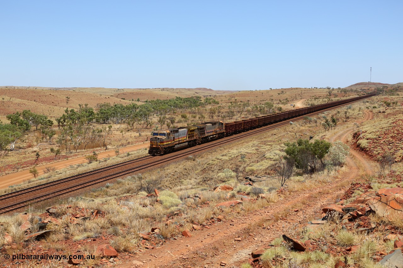 151111 9577
An empty train is still struggling upgrade at the 98 km post on the Tom Price line behind double General Electric Dash 9-44CW units 9403 serial 53457 wearing ROBE Pilbara Rail livery and 7087 serial 47766 wearing the original Hamersley Iron livery.
Keywords: 9403;GE;Dash-9-44CW;53457;