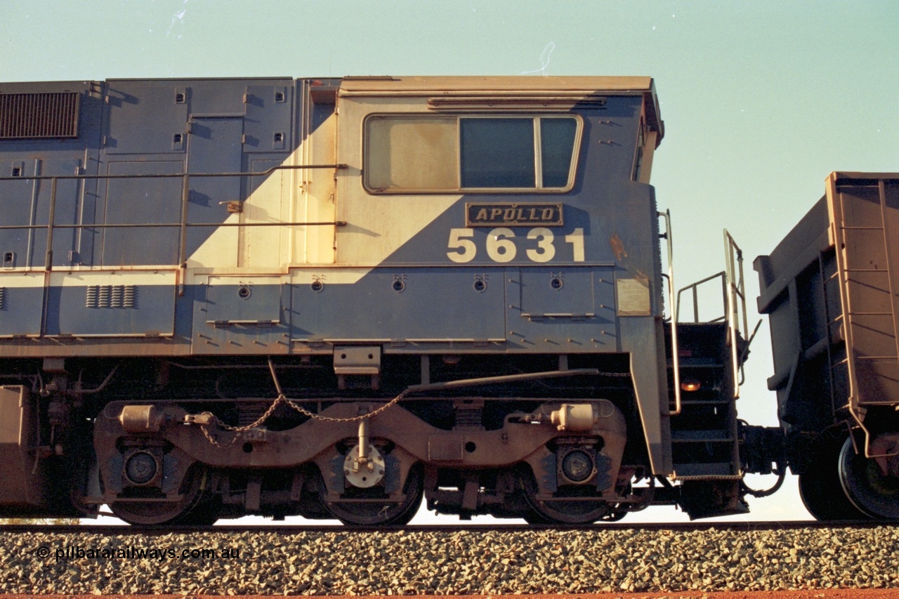 196-06
Yandi Two, BHP Iron Ore 5631 'Apollo' serial 5831-10 / 88-080 originally built new by Goninan as a GE CM39-8 in 1988. Drivers side cab view shows hand brake chain and bogie. May 1998.
Keywords: 5631;Goninan;GE;CM39-8;5831-10/88-080;