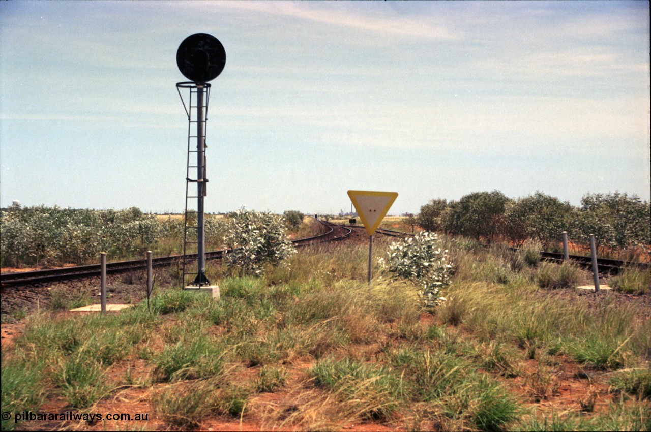 197-01
Goldsworthy Junction, looking west with the end of the triangle or wye, signal post is GJ 7, empty iron ore train on approach.
