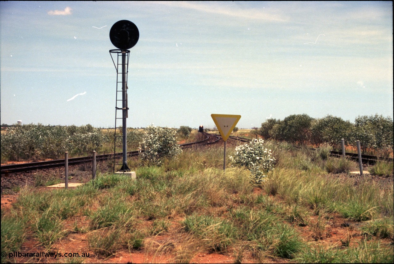 197-02
Goldsworthy Junction, looking west with the end of the triangle or wye, signal post is GJ 7, empty iron ore train on approach.
