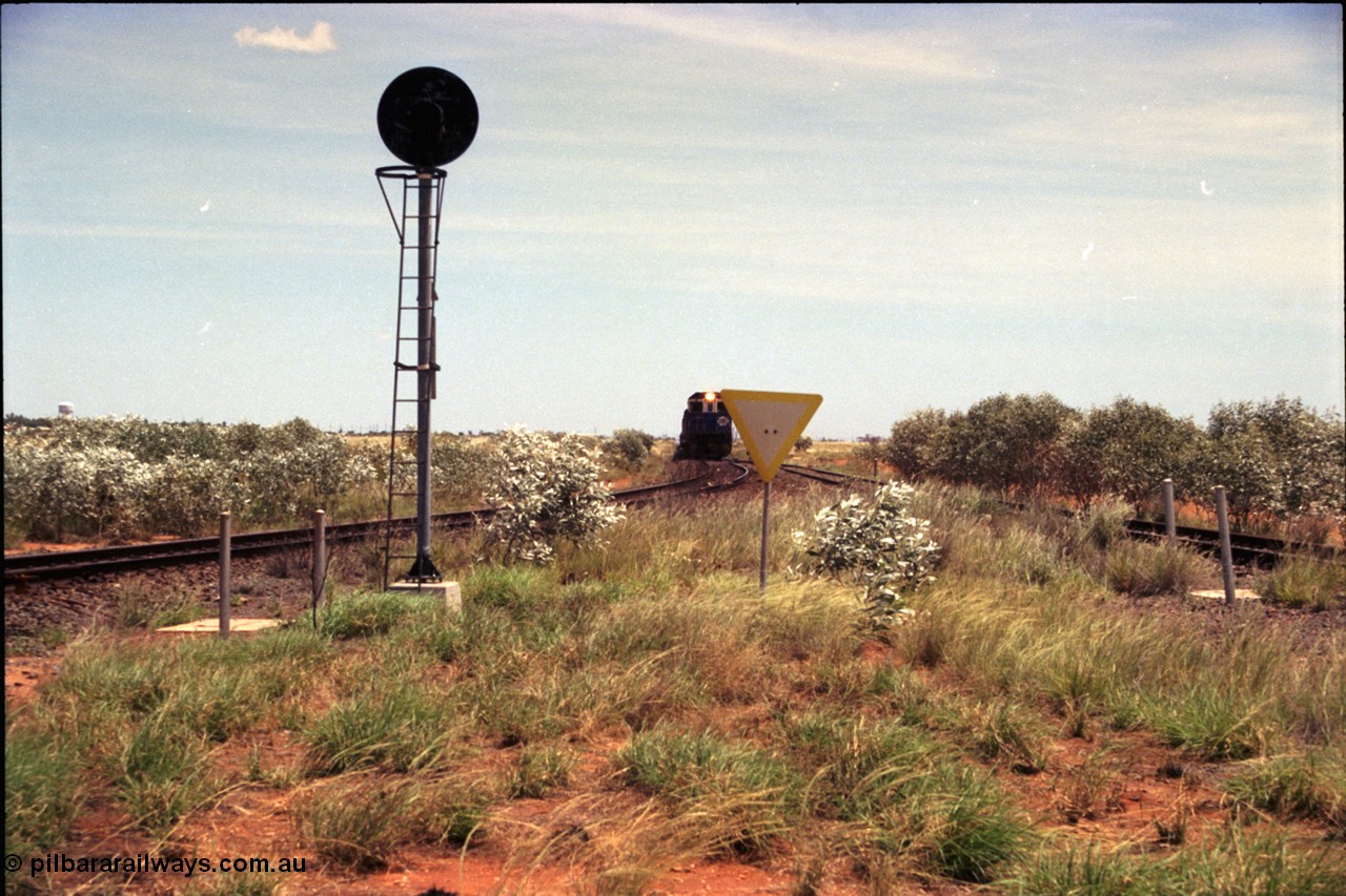 197-03
Goldsworthy Junction, looking west with the end of the triangle or wye, signal post is GJ 7, empty iron ore train on approach.
