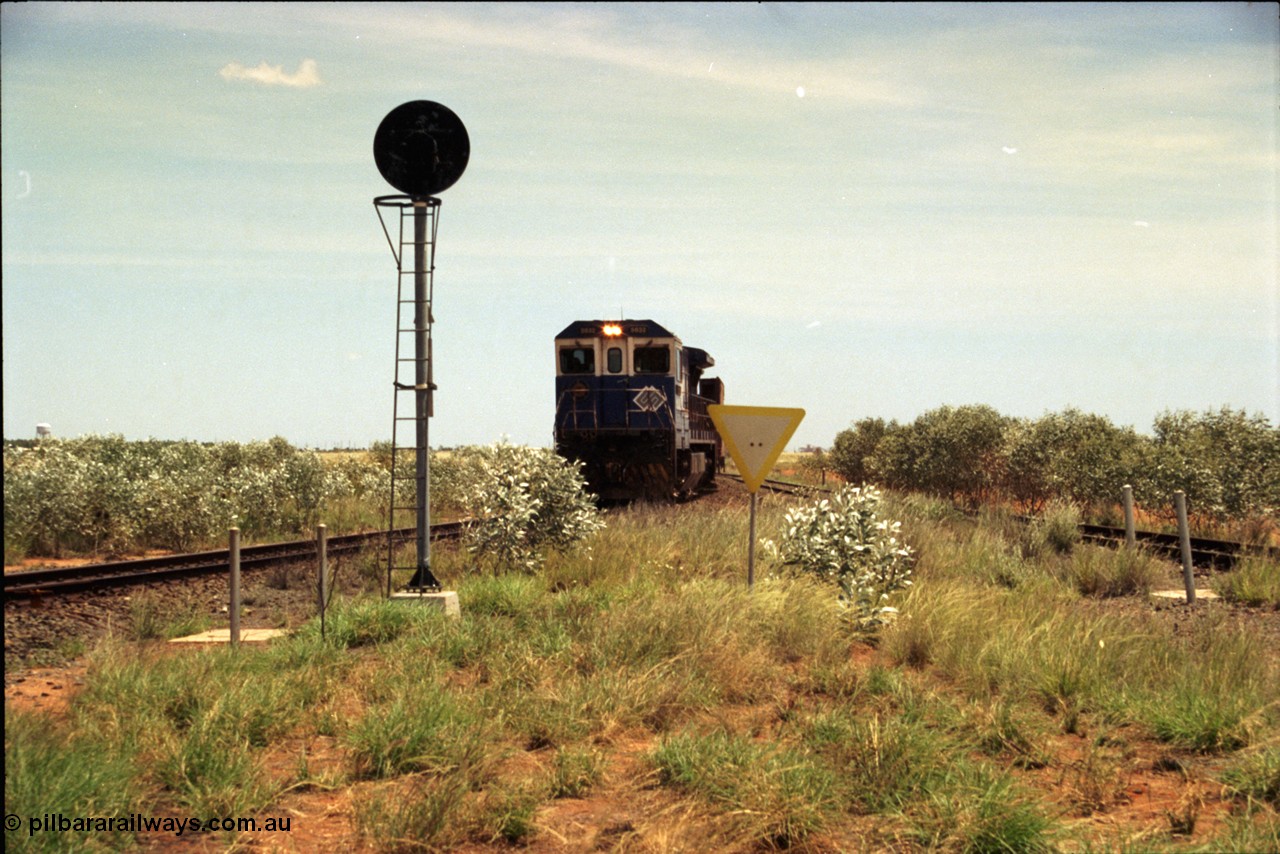197-04
Goldsworthy Junction, looking west with the end of the triangle or wye, signal post is GJ 7, empty iron ore train behind BHP's Goninan 1988 build GE CM39-8 unit 5632 'Poseidon' serial 5831-11 / 88-081.
Keywords: 5632;Goninan;GE;CM39-8;5831-11/88-081;