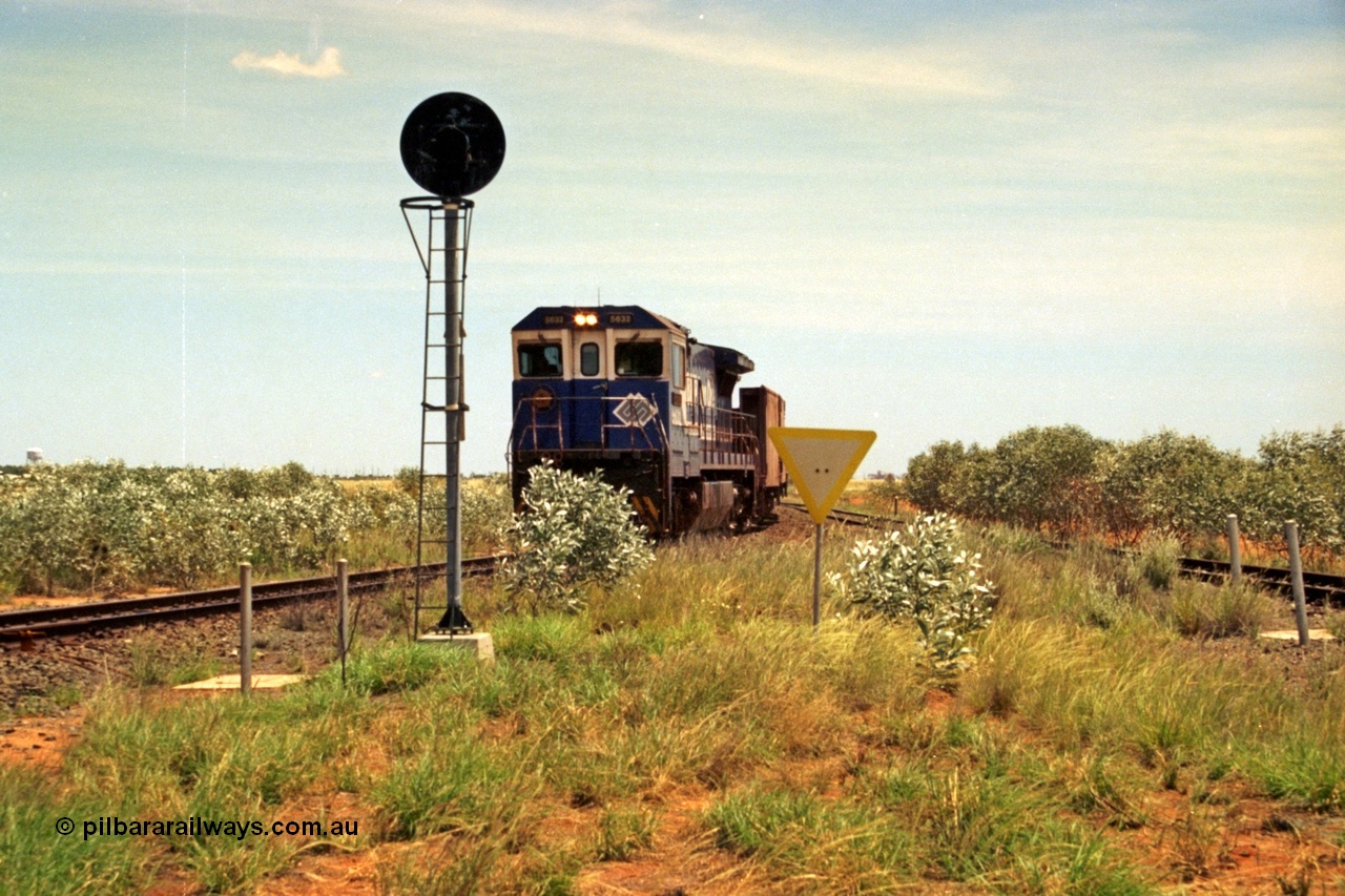 197-05
Goldsworthy Junction, looking west with the end of the triangle or wye, signal post is GJ 7, empty iron ore train behind BHP's Goninan 1988 build GE CM39-8 unit 5632 'Poseidon' serial 5831-11 / 88-081.
Keywords: 5632;Goninan;GE;CM39-8;5831-11/88-081;