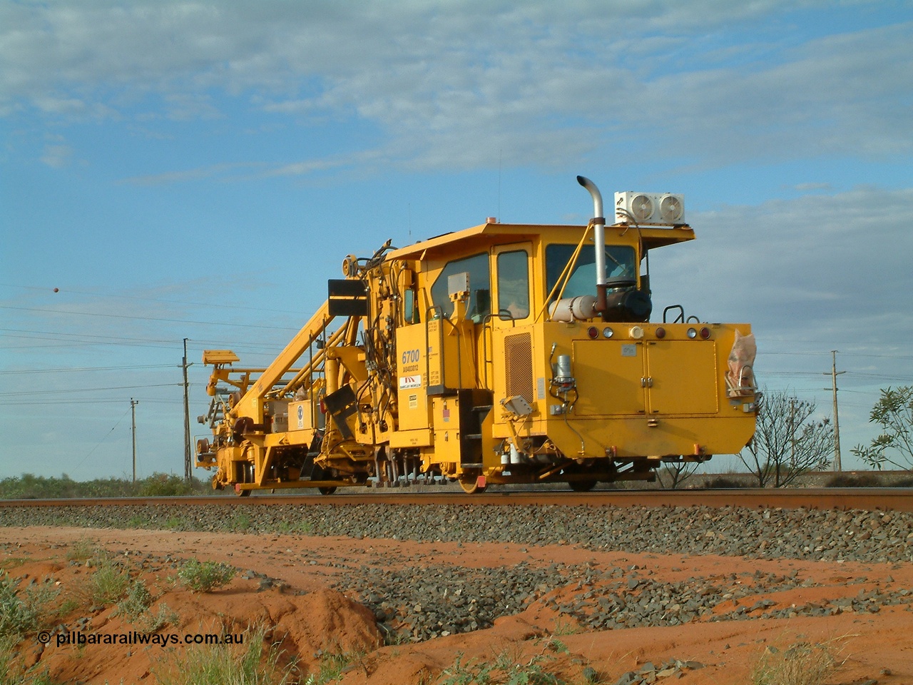 040407 073250
Goldsworthy Junction, Barclay Mowlem track tamper a Fairmont Jackson model 6700 production and switch tamper serial 153172, runs east along the Goldsworthy line. 7th April 2004.
Keywords: Jackson;6700;153172;track-machine;