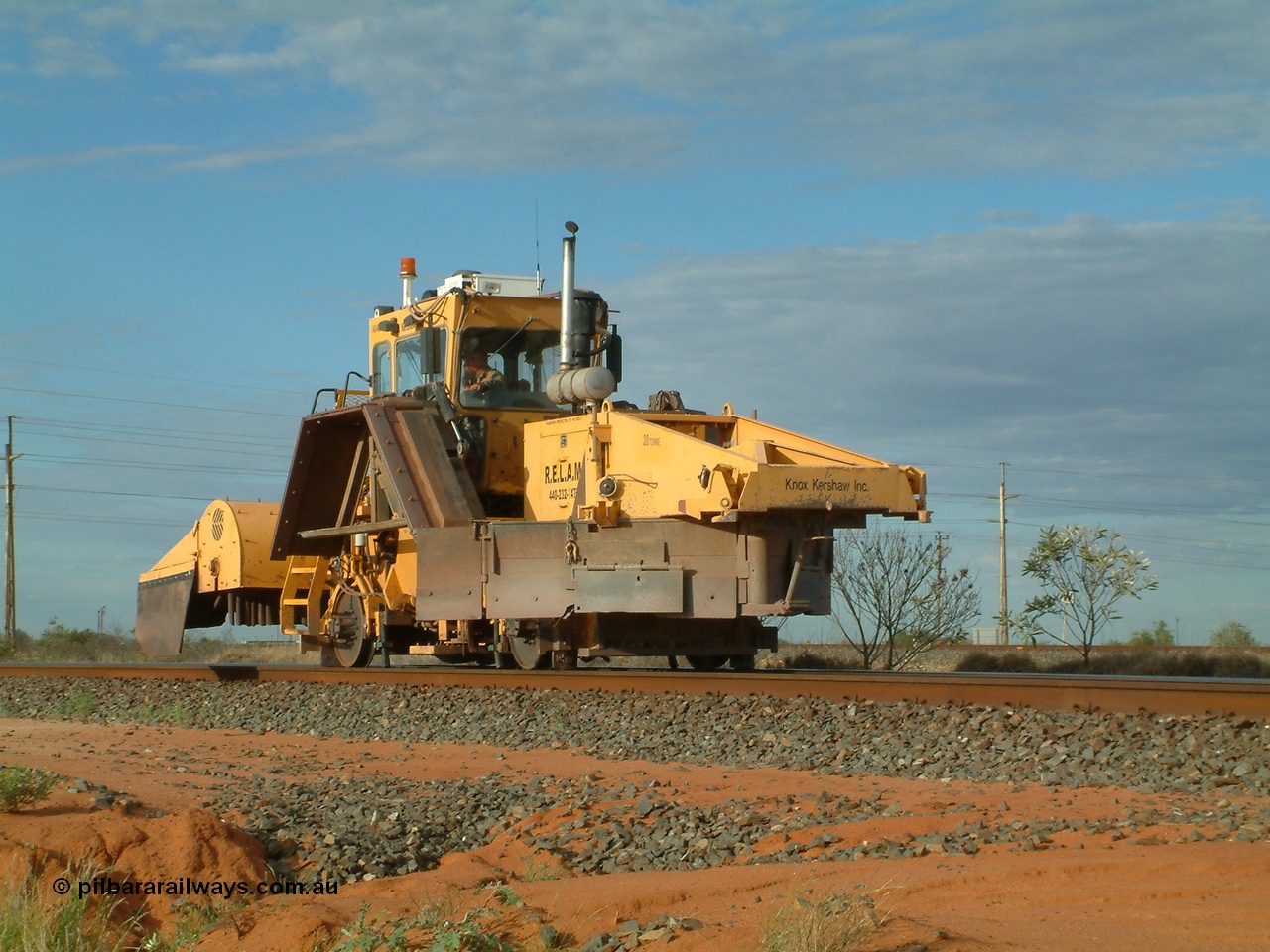 040407 073334
Goldsworthy Junction, Barclay Mowlem's R.E.L.A.M lease ballast plough, Knox Kershaw KBR 850 model travels east along the Goldsworthy line. 7th April 2004.
Keywords: Knox-Kershaw;KBR-850;track-machine;
