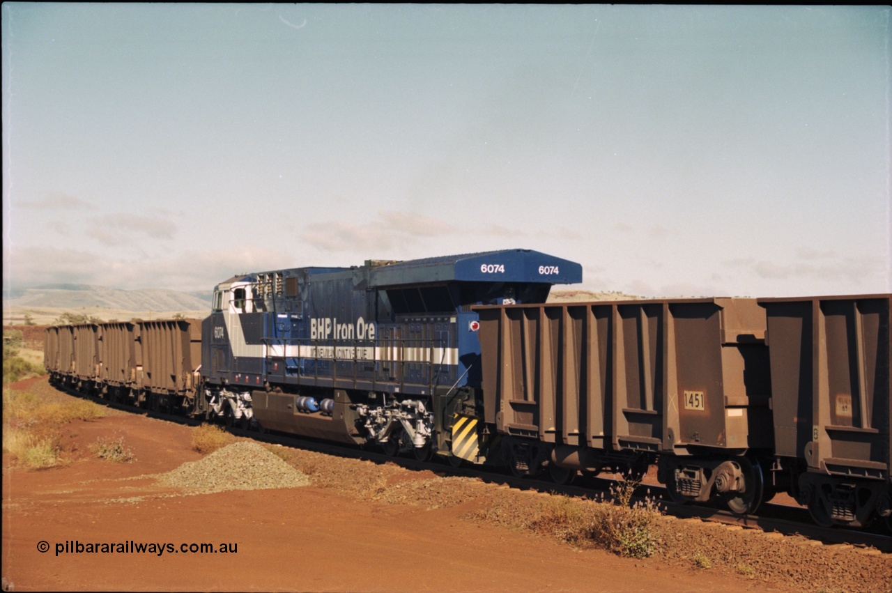 207-06
BHP General Electric built AC6000 unit 6074 serial 51066, brand new and unnamed at Yandi One load-out loop as a remote mid-train unit.
Keywords: 6074;GE;AC6000;51066;