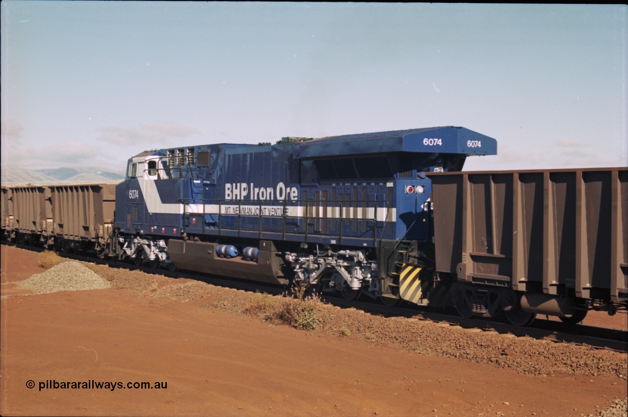 207-08
BHP General Electric built AC6000 unit 6074 serial 51066, brand new and unnamed at Yandi One load-out loop as a remote mid-train unit.
Keywords: 6074;GE;AC6000;51066;