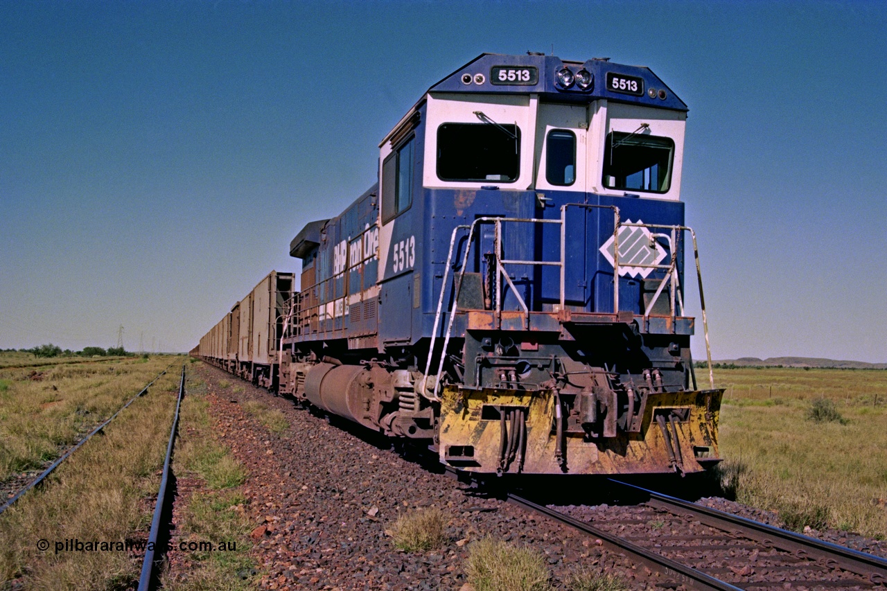 207-21
Hardie Siding, BHP locomotive 5513 is the final member of Goninan rebuilds from ALCo C636 5453 into a GE C36-7M unit 5513 serial 4839-02 / 88-078, with 'Kalgan' nameboards removed for fitting to AC6000 class 6074, holds the main with a loaded Yarrie train awaiting a cross.
Keywords: 5513;Goninan;GE;C36-7M;4839-02/88-078;rebuild;AE-Goodwin;ALCo;C636;5453;G6012-2;