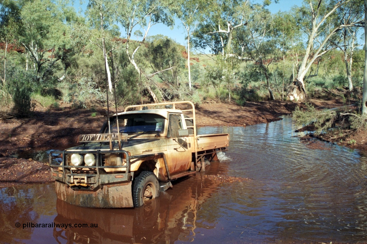 218-02
Yandi, river access road that runs between Roy Hill Rd and Yandi Junction, sort of following the train line, Toyota Land Cruiser Toy Titan, 1994 HJ75 series tray back.
