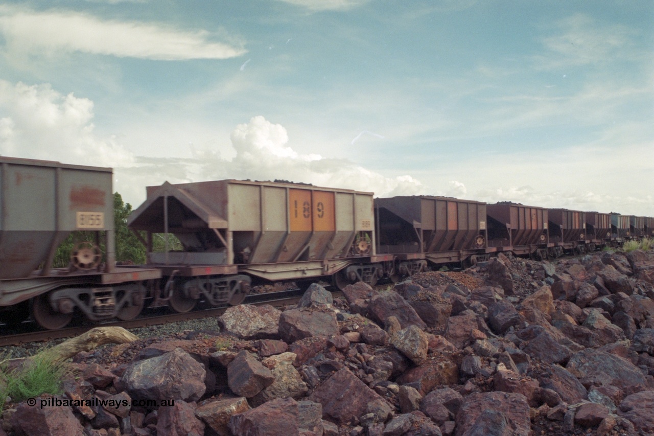 218-16
De Grey River Bridge, a loaded GML train with the original AE Goodwin designed and Tomlinson Steel Perth and Scotts of Ipswich built waggons.
