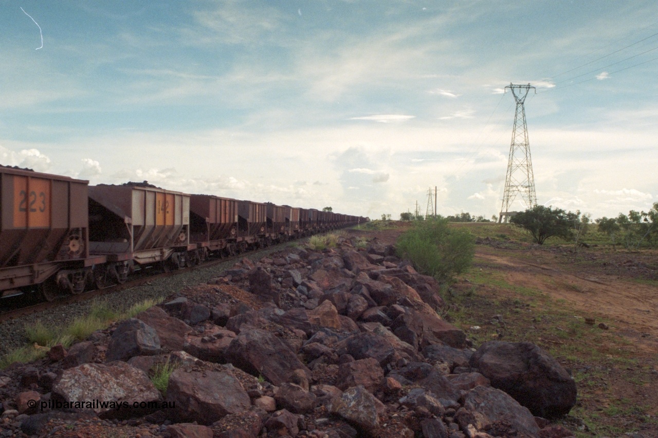 218-17
De Grey River Bridge, a loaded GML train with the original AE Goodwin designed and Tomlinson Steel Perth and Scotts of Ipswich built waggons.
