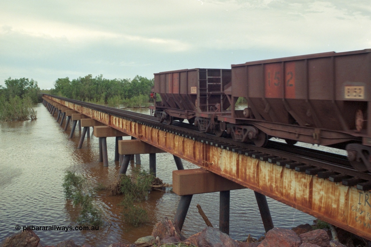 218-18
De Grey River Bridge, a loaded GML train with the original AE Goodwin designed and Tomlinson Steel Perth and Scotts of Ipswich built waggons.
