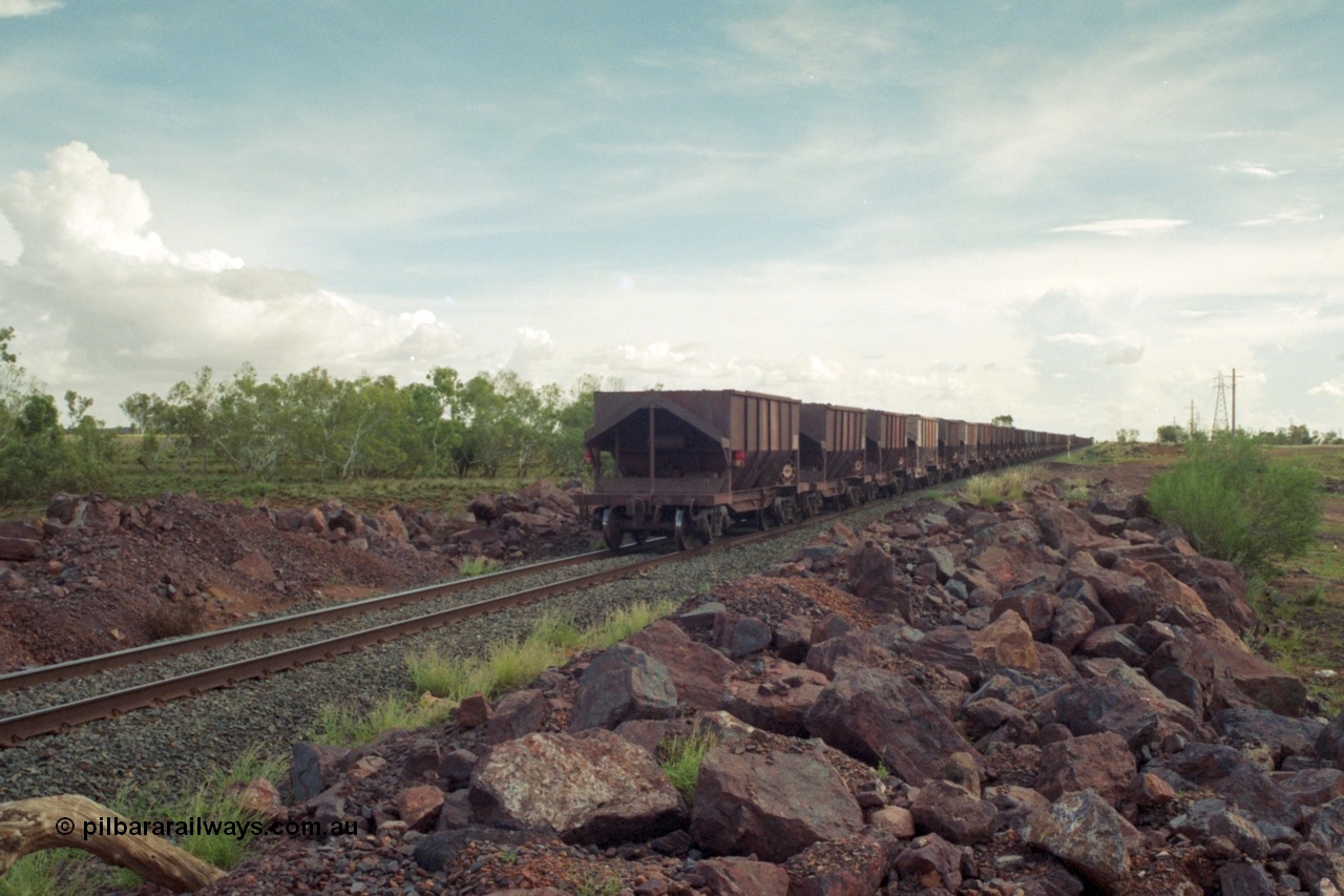 218-19
De Grey River Bridge, a loaded GML train with the original AE Goodwin designed and Tomlinson Steel Perth and Scotts of Ipswich built waggons.
