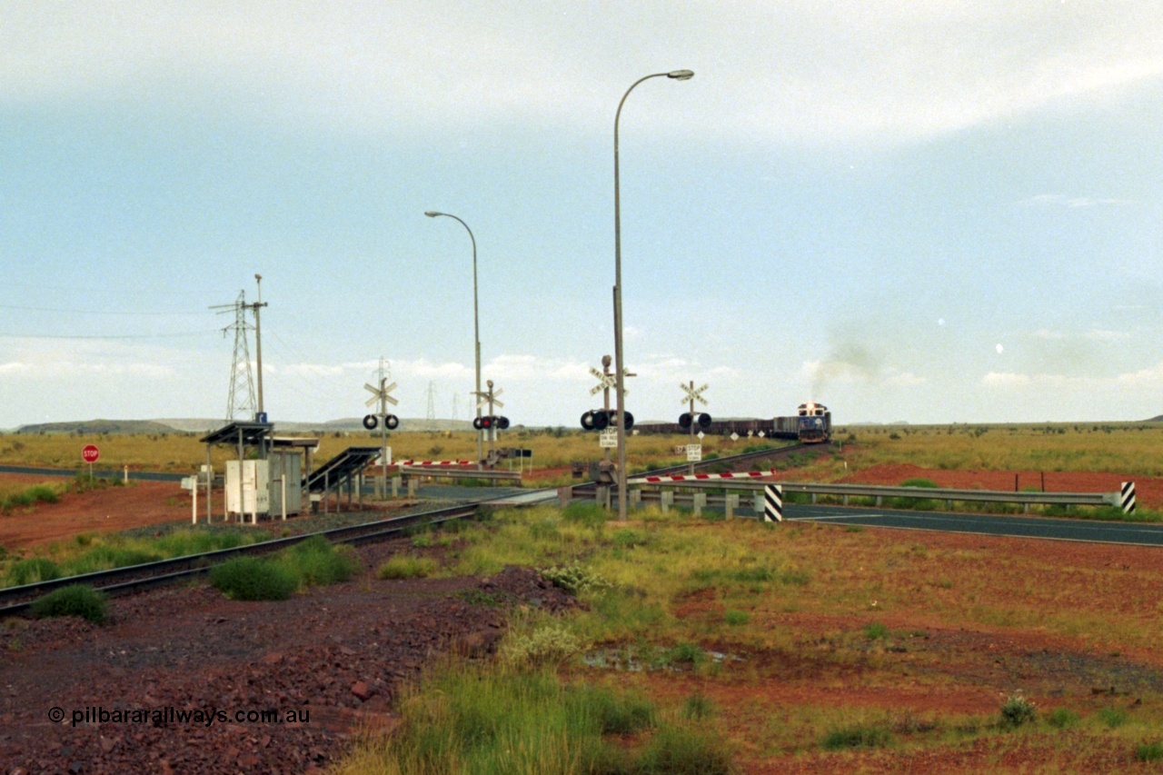 218-21
De Grey, Great Northern Highway grade crossing at the 57.15 km with a loaded train on approach.
Keywords: 5510;Goninan;GE;C36-7M;4839-07/87-075;rebuild;AE-Goodwin;ALCO;C636;5458;G6027-2;