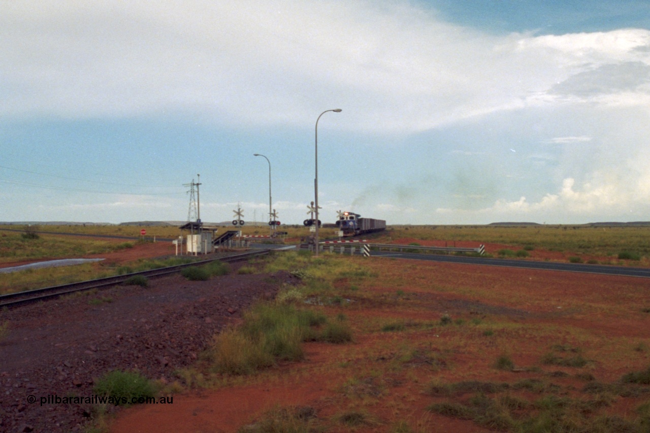 218-22
De Grey, Great Northern Highway grade crossing at the 57.15 km with a loaded train on approach.
Keywords: 5510;Goninan;GE;C36-7M;4839-07/87-075;rebuild;AE-Goodwin;ALCO;C636;5458;G6027-2;