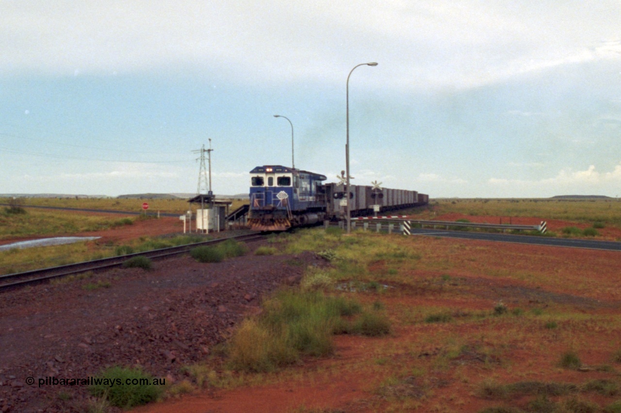 218-23
De Grey, Great Northern Highway grade crossing at the 57.15 km a loaded GML train behind an original Mt Newman Mining ALCo C636 5458 to GE C36-7M rebuild carried out by Goninan unit 5510 'Newman' serial 4839-07 / 87-075.
Keywords: 5510;Goninan;GE;C36-7M;4839-07/87-075;rebuild;AE-Goodwin;ALCO;C636;5458;G6027-2;