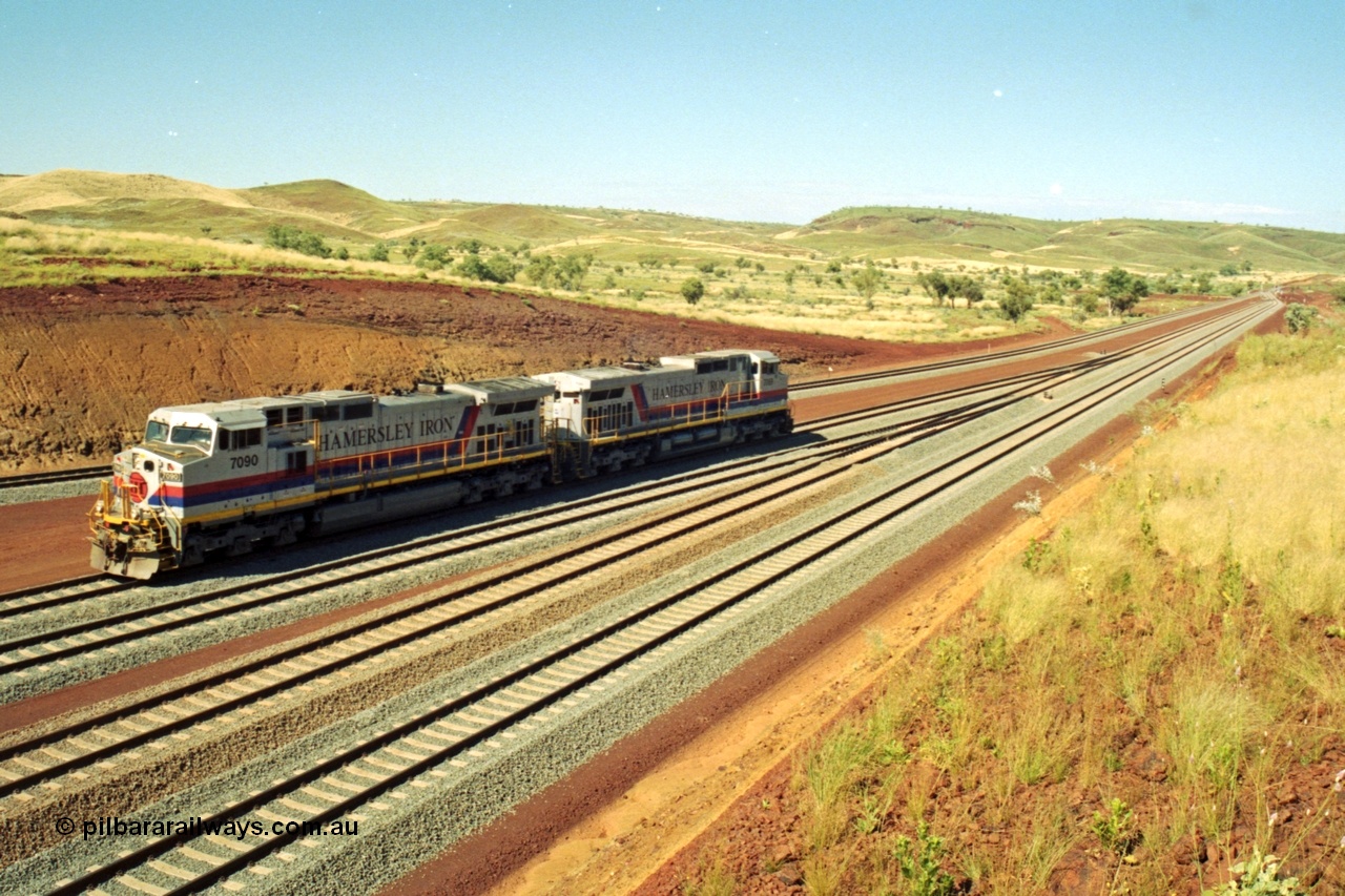 218-27
Yandicoogina or HIY as Hamersley Iron identify it, located 445 km from Parker Point yard in Dampier. Bank engine units General Electric Dash 9-44CW models 7090 serial 47769 and 7089 idle away waiting their next loaded train to push out.
Keywords: 7090;GE;Dash-9-44CW;47769;