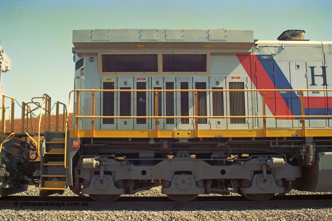 219-08
Yandicoogina or HIY as Hamersley Iron identify it, located 445 km from Parker Point yard in Dampier. Bank engine unit General Electric Dash 9-44CW model 7090 serial 47769 view of radiator and rear bogie, coupled to 7089. In the original 'Pepsi Can' livery as delivered.
Keywords: 7090;GE;Dash-9-44CW;47769;
